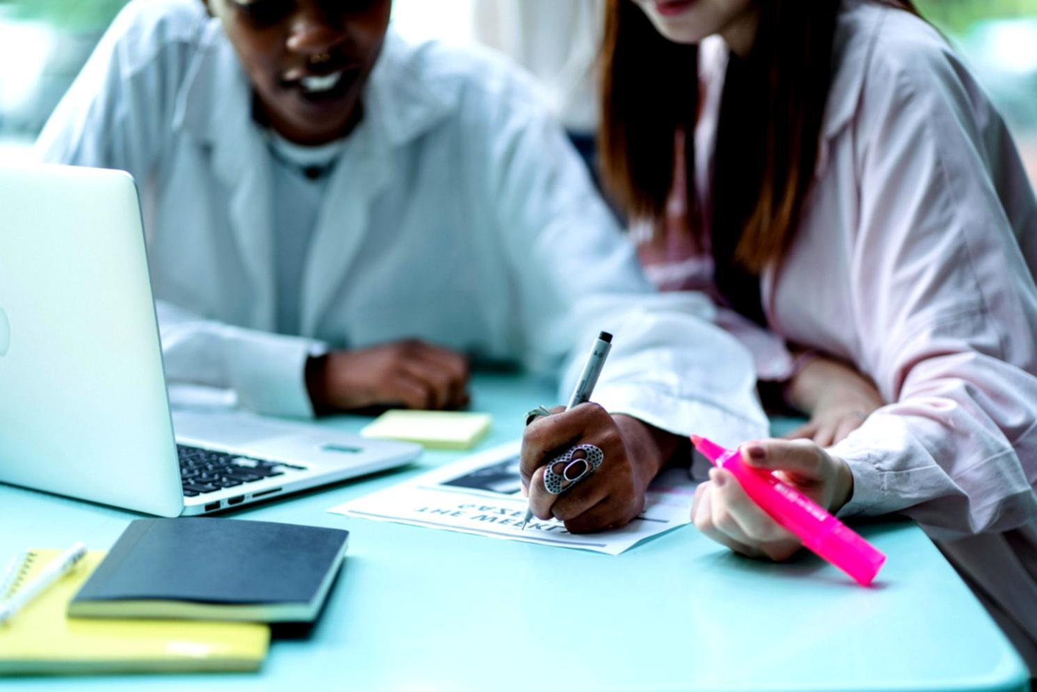 Office workspace showing organized business consultation materials and planning documents